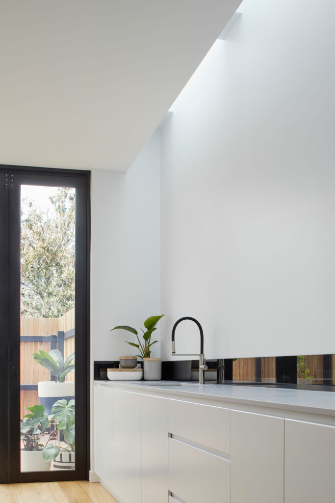 Maike Design white kitchen and skylight