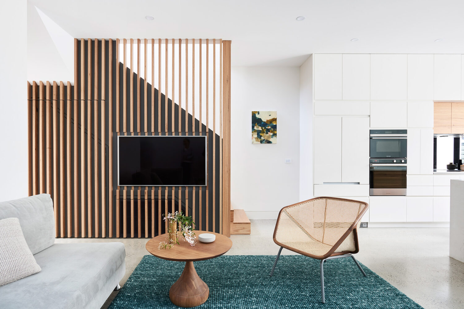 Maike Design lounge room with timber batten wall balustrade