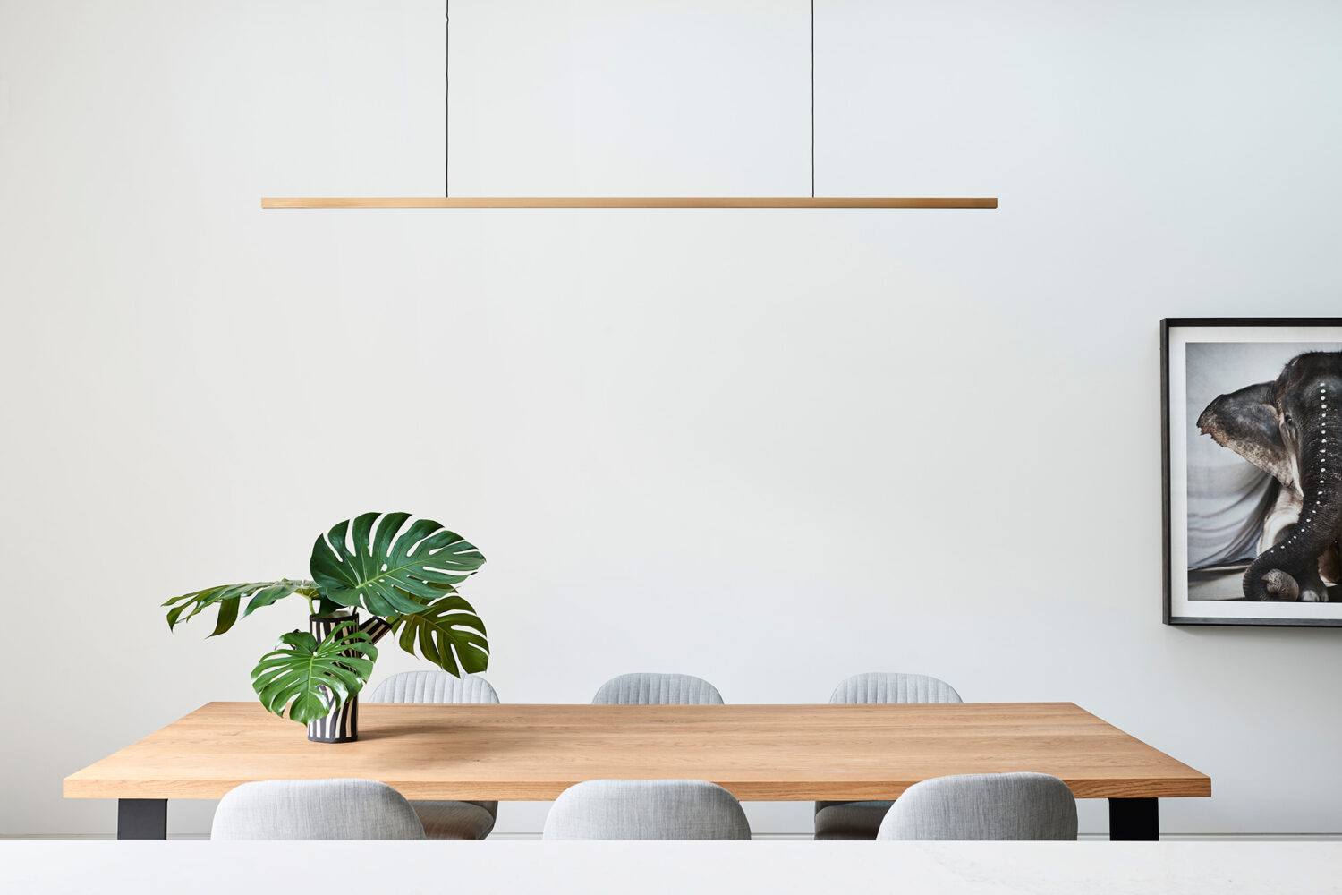 Maike Design timber dining table with pendant light