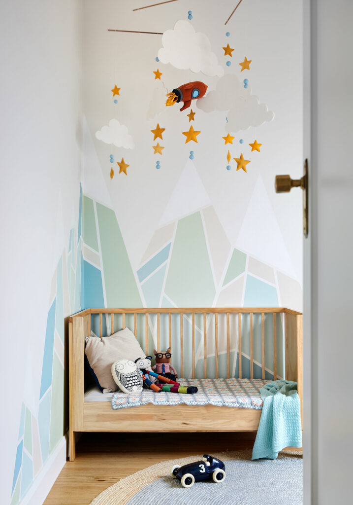 Maike Design nursery with hand made mobile and hand painted mural