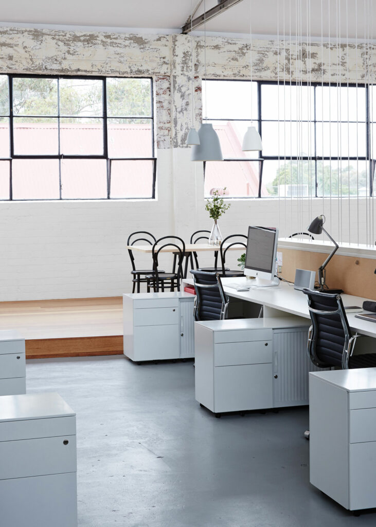 Maike Design Creative workspace, warehouse conversion. Industrial steel windows and desk space