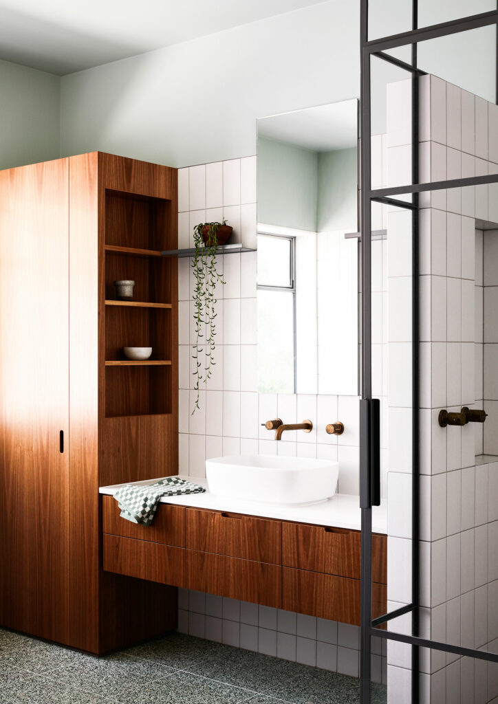 Maike Design bathroom. Timber joinery and brass tapware. Green painted ceiling and terazzo floor tiles. Steel framed shower.